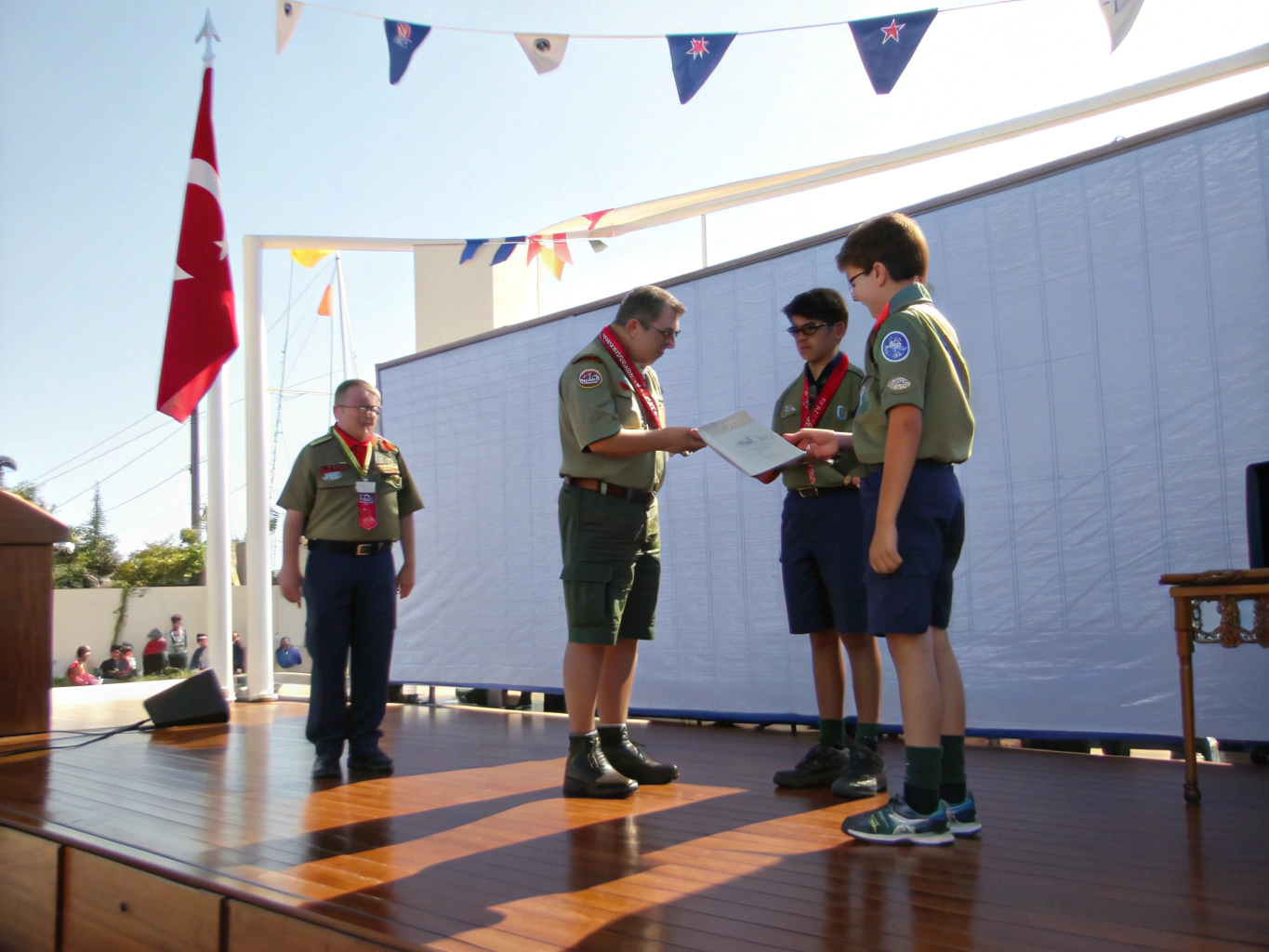 Troop 16 scout receiving rank badge at Court of Honor
